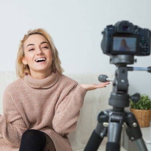 girl blogging in front of camera