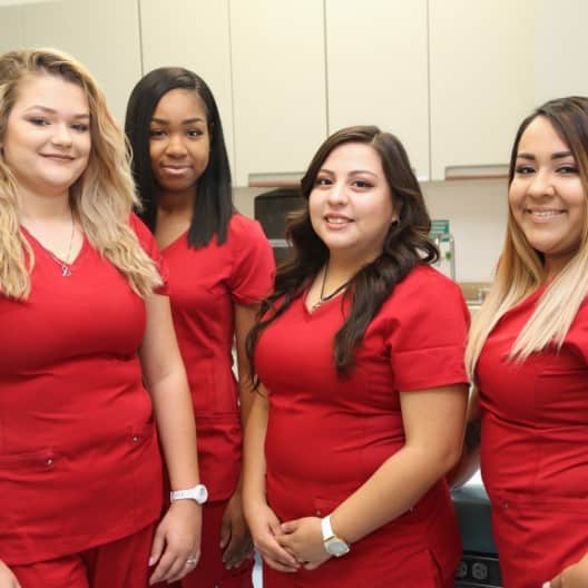 nursing student in red uniform in school